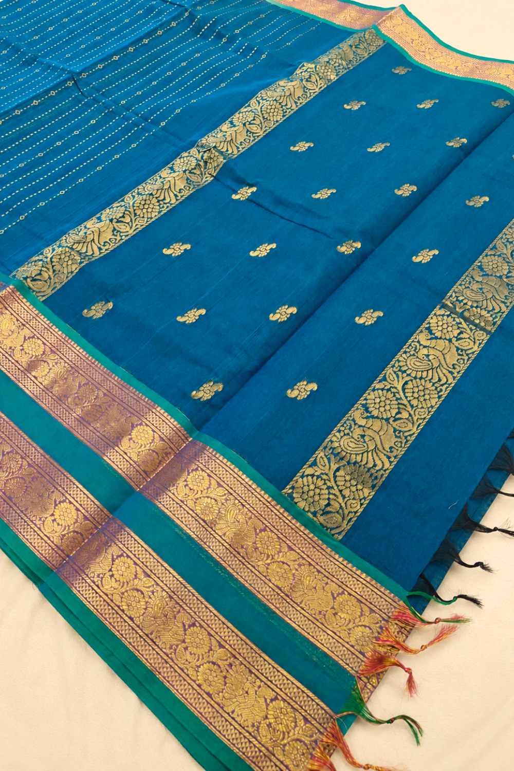 Peacock Blue Chettinad Cotton Saree with Rich Gold Zari Border & Floral Motifs