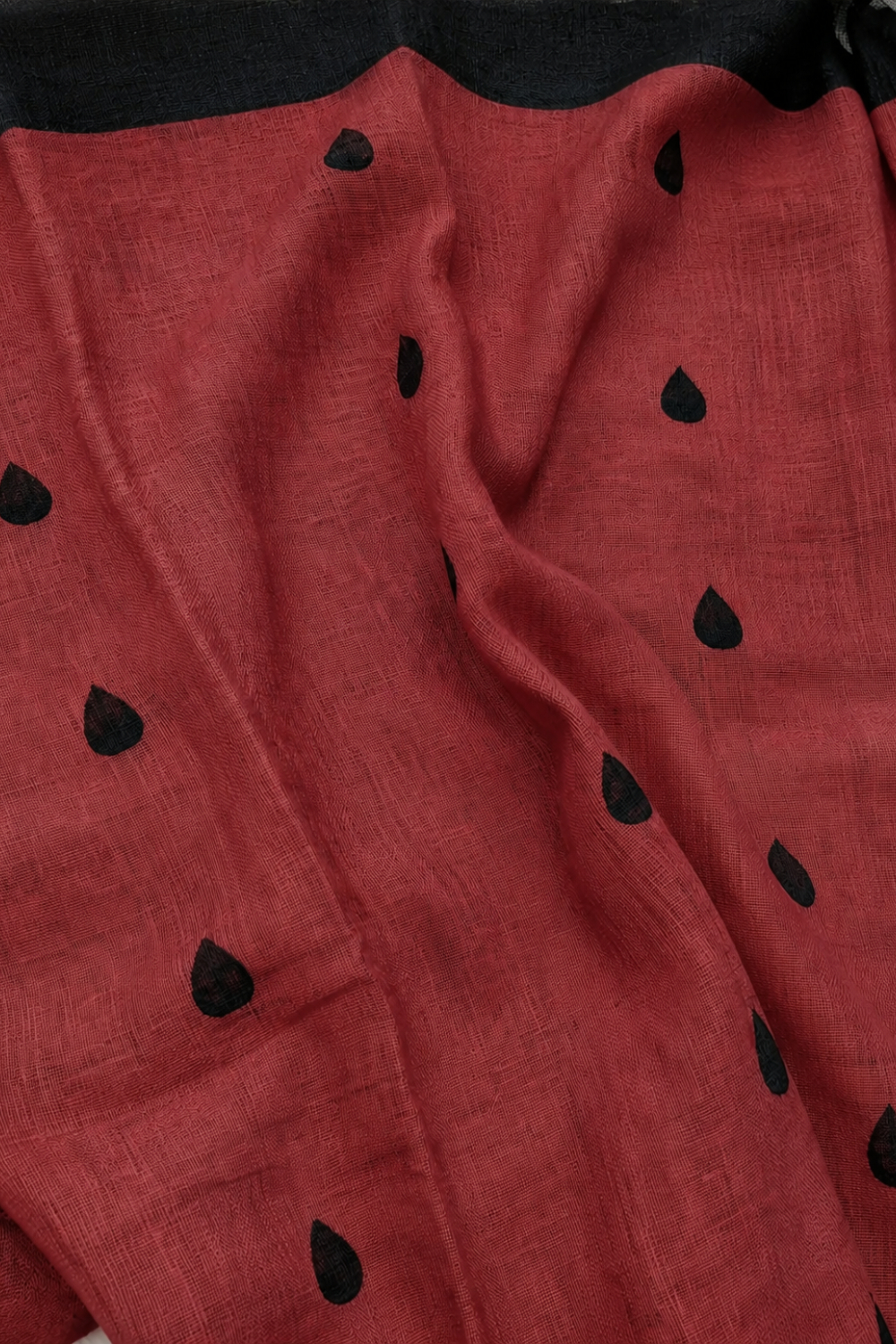 Crimson Red Linen Blend Saree with Black Drop Motifs