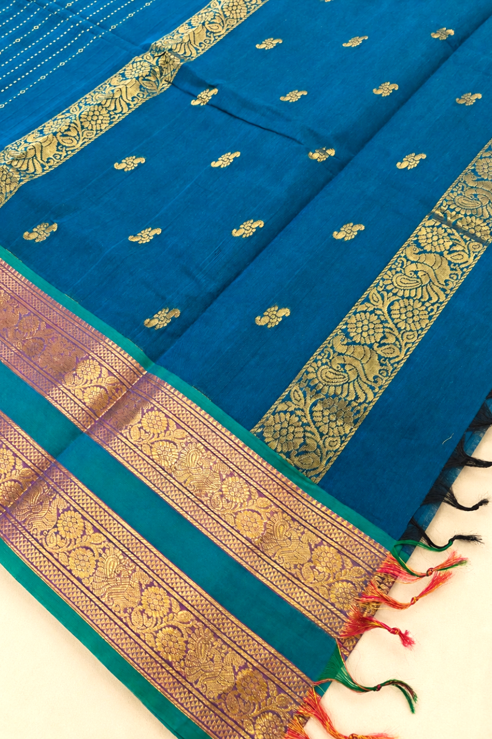 Peacock Blue Chettinad Cotton Saree with Rich Gold Zari Border & Floral Motifs