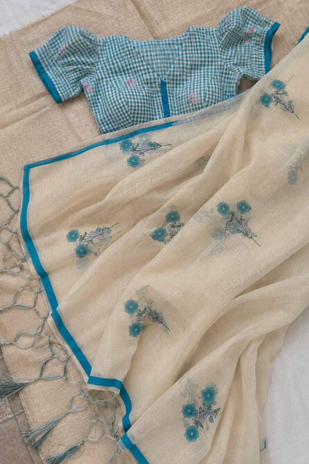 Ivory Linen Blend Saree with Blue Floral Prints and Contrast Blue & White Checked Floral Blouse